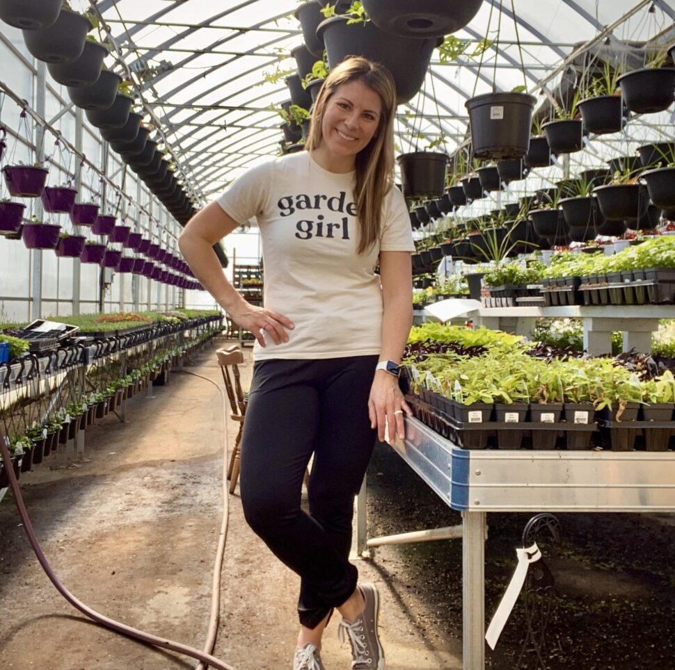 Photo of Cari Letourneau in a greenhouse