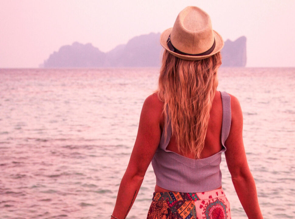 Woman looking out onto the ocean